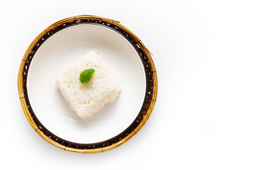 Asian Food concept Thail jasmine rice long grain rice in ceramic and bamboo tray on white background with copy space