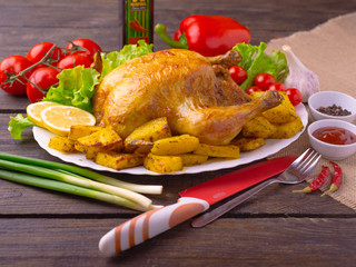 Chicken baked in the oven with potatoes.