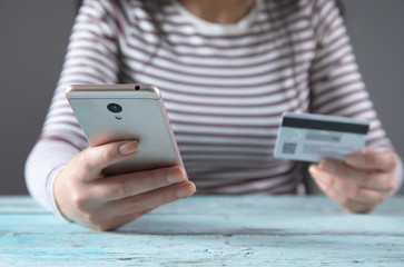 woman hand phone and credit card