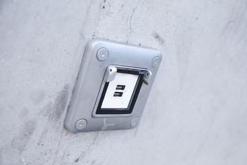 USB ports electronic plug on cement wall