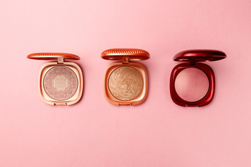 Set of professional elite decorative cosmetics for makeup on a pink background. The concept of beauty and fashion. Mua and girly concept. Eye shadows cosmetics product as luxury beauty brand promotion