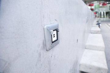 USB ports electronic plug on cement wall