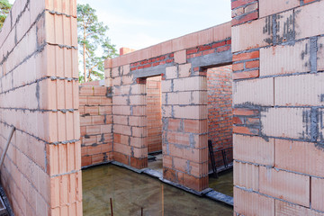 Interior of a Unfinished Red Brick House Walls under Construction without Roofing