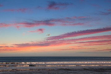 sunset over the sea in a private plane