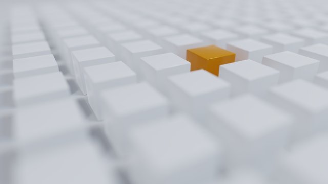 Einzelner orangener W&uuml;rfel unter vielen wei&szlig;en W&uuml;rfeln