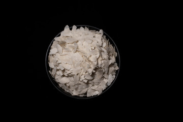 Top down image of a bowl of rice cereals in a dark copy space background. Food and product photography.
