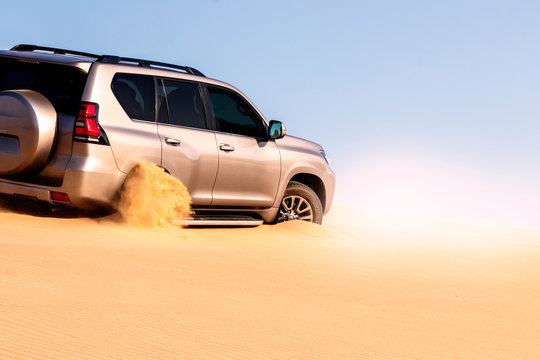 Close Up Of A Golden Car Stuck In The Sand In The Namib Desert.