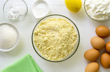 Step by step recipe of cheesecake. Bowl with mixture butter and flour