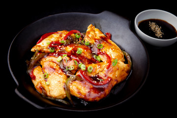chicken teriyaki on the black plate
