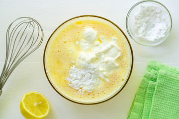 Step by step recipe of cheesecake. Toppings with eggs, sour cream and sugar