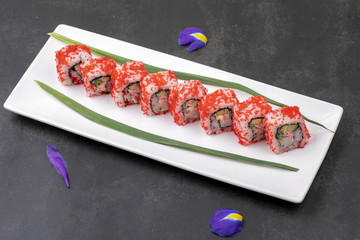 Making Rolled Sushi in a bamboo Sushi Mat