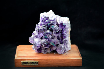 Purple Crystal Stone macro mineral. Purple rough amethyst quartz crystals geode