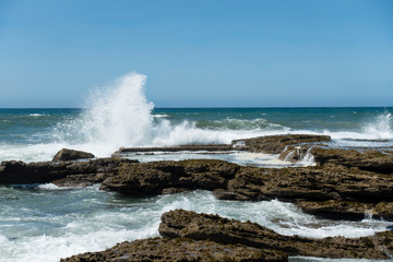 waves crashing on rocks