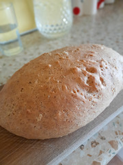 Fresh light brown bread on the table.