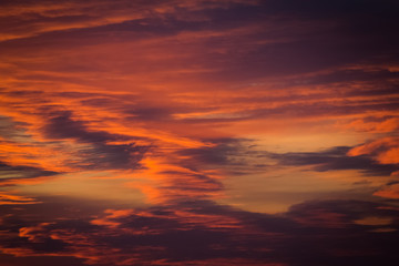 Naklejka na ściany i meble cloudy orange sky in the sunset