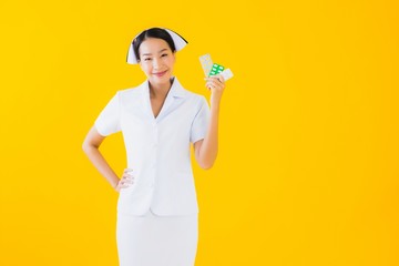 Portrait beautiful young asian woman thai nurse with pill or drug