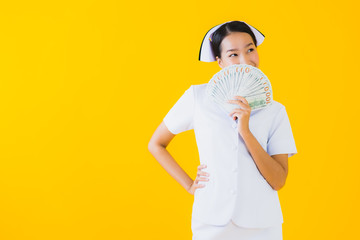 Portrait beautiful young asian woman thai nurse with a lot of cash and money