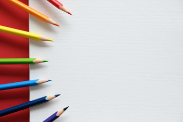 Album and color pencils on the table. Creativity concept