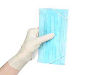 Woman hand in medical gloves holds medical mask