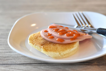 Tomato sauce on bacon and pancakes ready to serve for people.