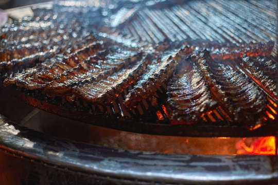 Cooking pork ribs on a big BBQ