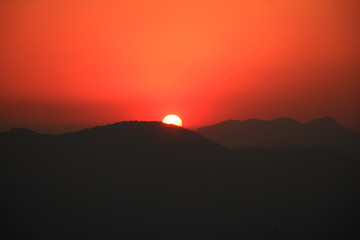 Beautiful sunset over layered mountain ranges