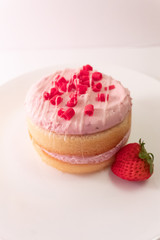 mini stacked cake with strawberry on white plate