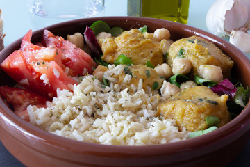 Vegan food. Meatballs of chickpeas, rice, tomato and salad.