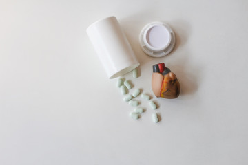 Heart medication that was prepared on the table in the room in the morning The concept of health care and treatment of heart disease with medication as recommended by doctors.