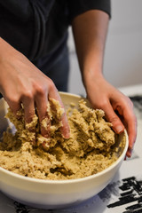 mixing ingredients to make cookies dough close up