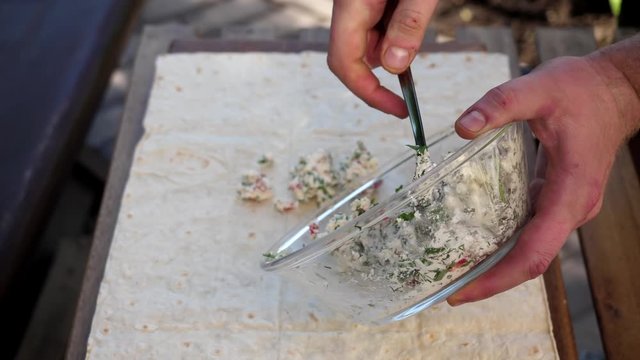 Very tasty roll with a filling of tomatoes, cheese, mushrooms and herbs. 4K video. average plan