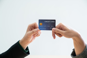 Businessman hands holding credit card on white background / business concept / payment and expense concept / successful job.