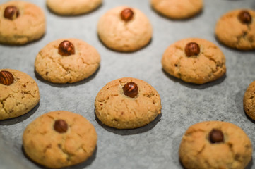 Hazelnut cookies on baking sheet close up