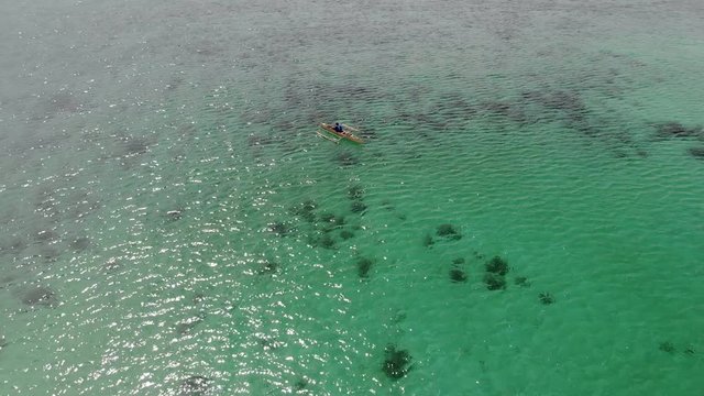 Flying over fisherman's boat next to Bantayan island, Cebu, Philippines