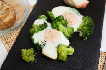 breakfast of crumpled eggs with broccoli