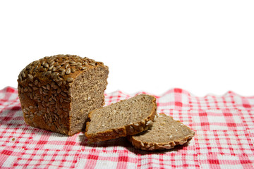 Sliced Multigrain bread isolated on a white background. Rye Bread slices with crumbs. Top view. Close-up