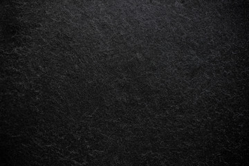 Dark grey black slate background or texture.