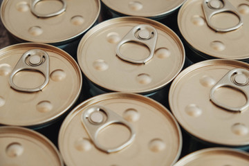 Metal closed canned food as a background image. Place for text or advertising. Top view