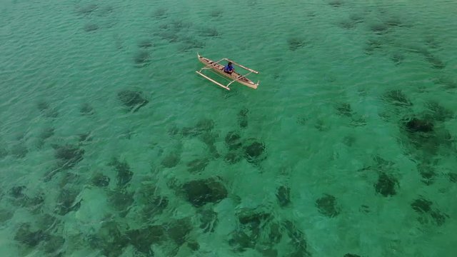 Flying over fisherman's boat next to Bantayan island, Cebu, Philippines