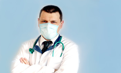 Portrait of a young caucasian doctor wearing protective mask with serious expression banner panoramic blue background. COVID-19 Coronavirus concept