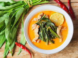 Morning glory vegetable curry with pork meat, traditional Thai food.