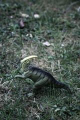 parasaurolophus dinosaur in green grass background jurassic world