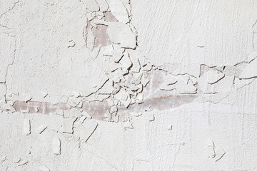 Cracked wall texture. Detailed white cement wall surface as a background