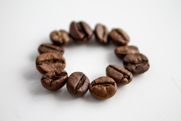 coffee beans in the shape of a circle on a white background