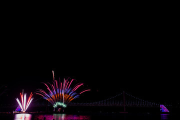 Colorful fireworks and Gwangan Bridge in Busan City , South Korea.
