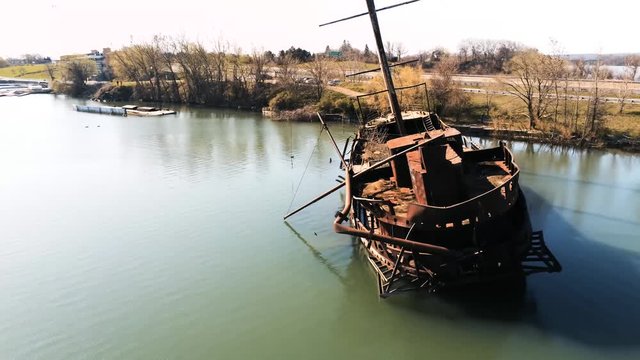 Drone pan view of the rear end of a sunken boat