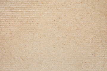 Fototapeta na wymiar Beige craft paper close-up, sheet of cardboard. Background, pattern.