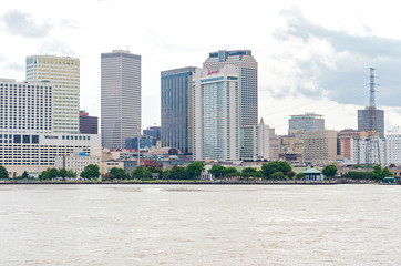 mississippi river walk and skyline of new orleans