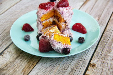 Carrot and cottage cheese cake with strawberries and black currant