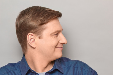 Fototapeta premium Portrait of blond mature man with happy expression and smiling